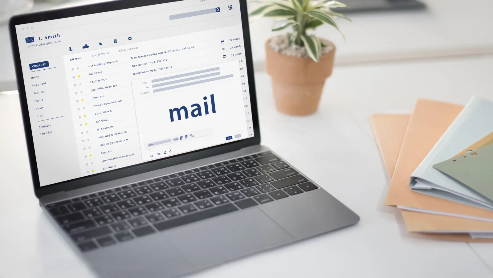 Person writing an email newsletter on a laptop